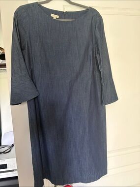 Denim woman’s Dress with Bell Sleeves  fits like a size 12. Has a stretch to it.